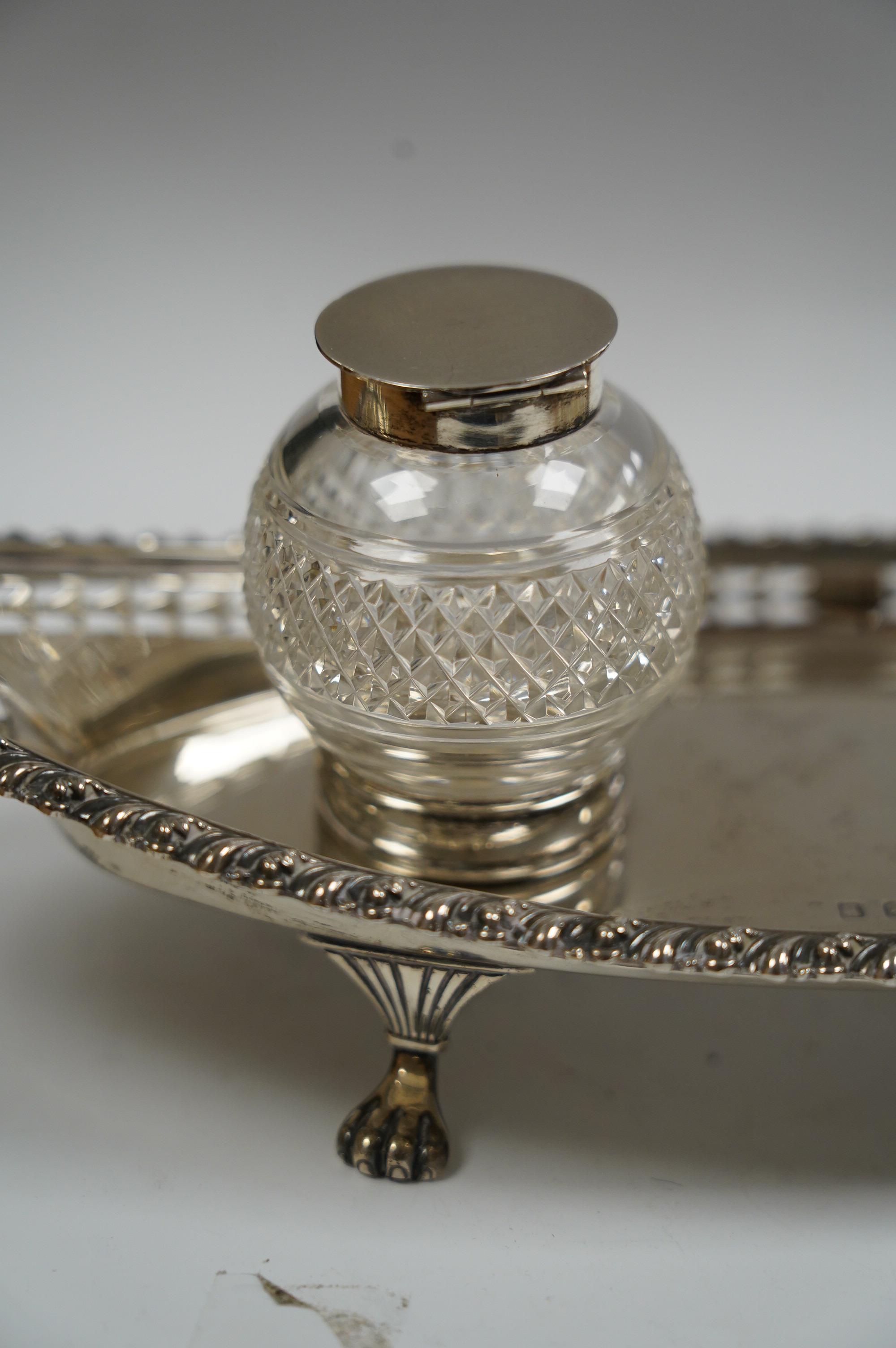 An Edwardian silver navette shaped inkstand, with two mounted glass wells, I.S. Greenburg & Co, Birmingham, 1901, 25.3cm, 7.5oz. Condition - fair